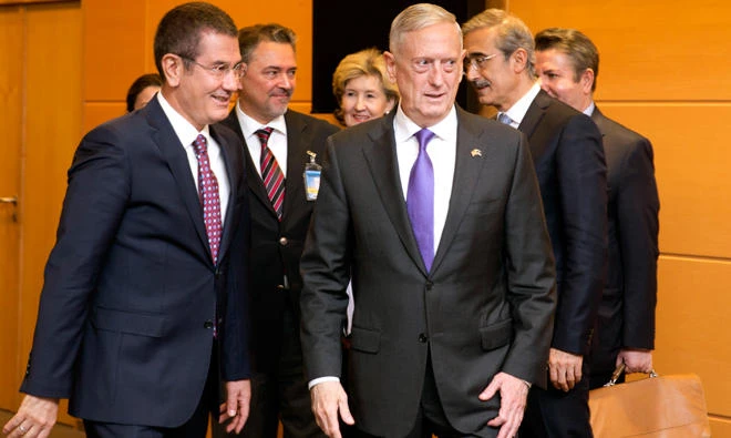 US Secretary for Defense Jim Mattis, center, walks with Turkish Defense Minister Nurettin Canikli, left, prior to a meeting in Brussels on Wednesday. (AP)