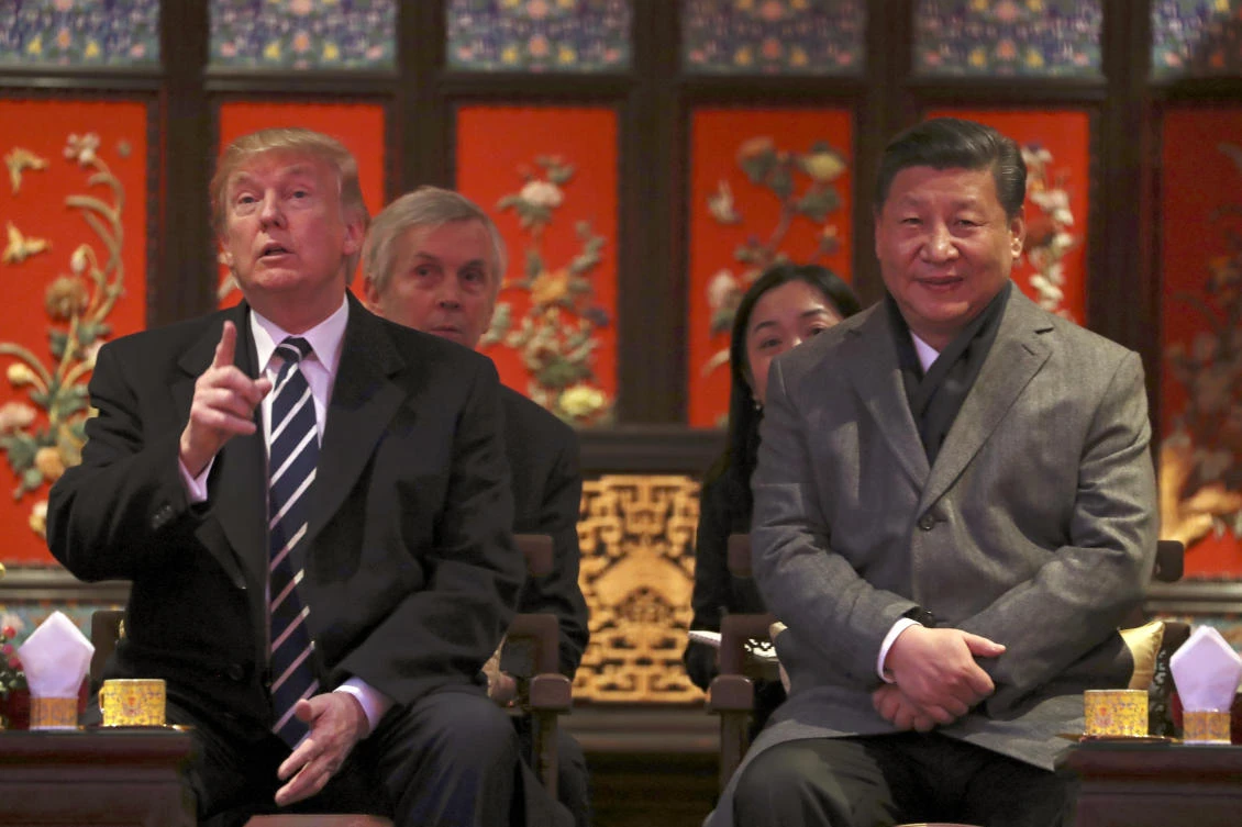 President Donald Trump, left, and Chinese President Xi Jinping, right, arrive for opera performance at the Forbidden City. Trump said expressed hopes ‘China will act faster and more effectively’ on the North Korean problem. (AP)
