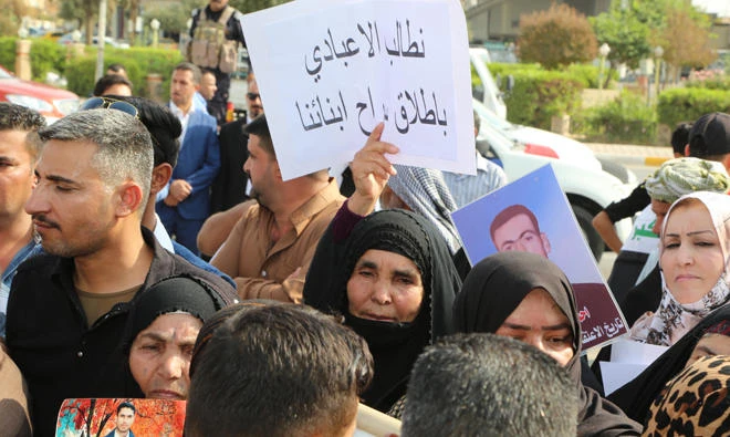 Iraqi-Arabs demonstrate in Kirkuk on Wednesday calling for human rights bodies to shed light on the whereabouts of relatives arrested by Kurdish forces since 2003. The protesters demanded the Iraqi authorities to investigate their cases. (AFP)