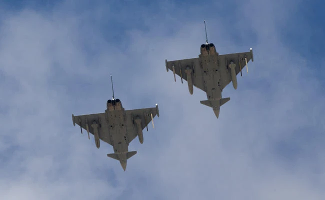In this Wednesday, Nov. 8, 2017 photo, two German Eurofighter Typhoon fighter jets fly over Ovda airbase near Eilat, southern Israel during the 2017 Blue Flag exercise. (AP Photo/Ariel Schalit)