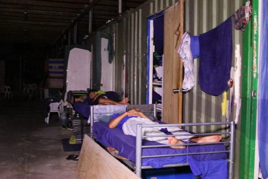 An undated handout photo from Australian advocacy group GetUp shows refugees at the Australian detention center on Manus Island in Papua New Guinea. Australia declared the center closed on October 31, shutting off water and electricity supplies following a Papua New Guinea Supreme Court ruling that the camp was unconstitutional. (GetUp / AFP)