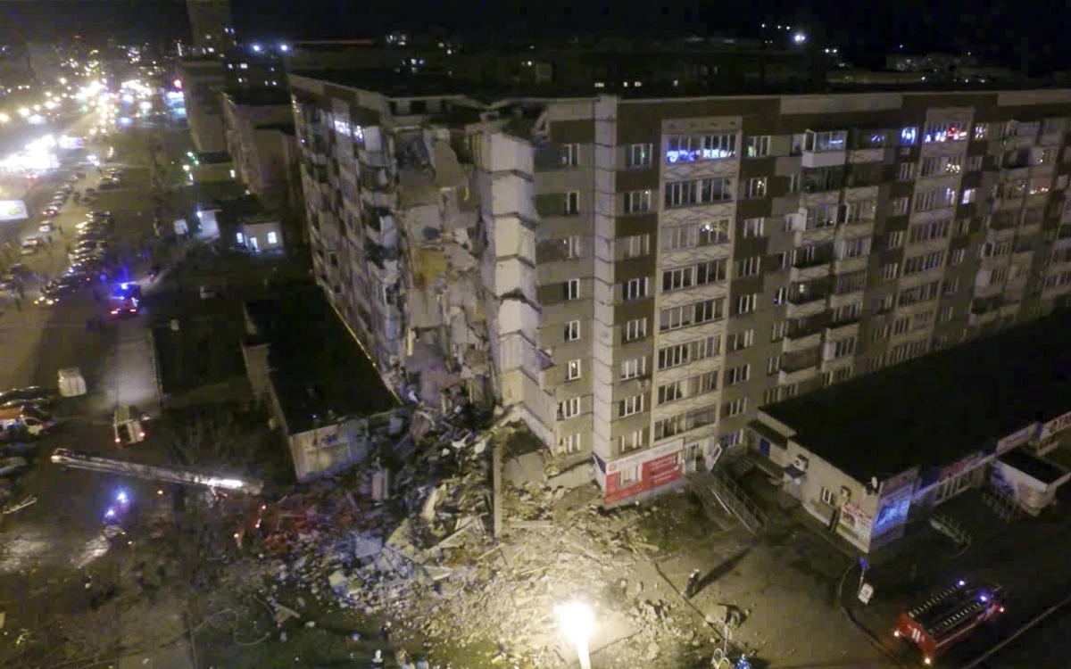 A photo provided by the Russian Emergency Situations Ministry made from television footage shows a collapsed section of a nine-story apartment building in Izhevsk. More than 200 rescuers are involved in the search for survivors. (Russian Ministry for Emergency Situations / AP)