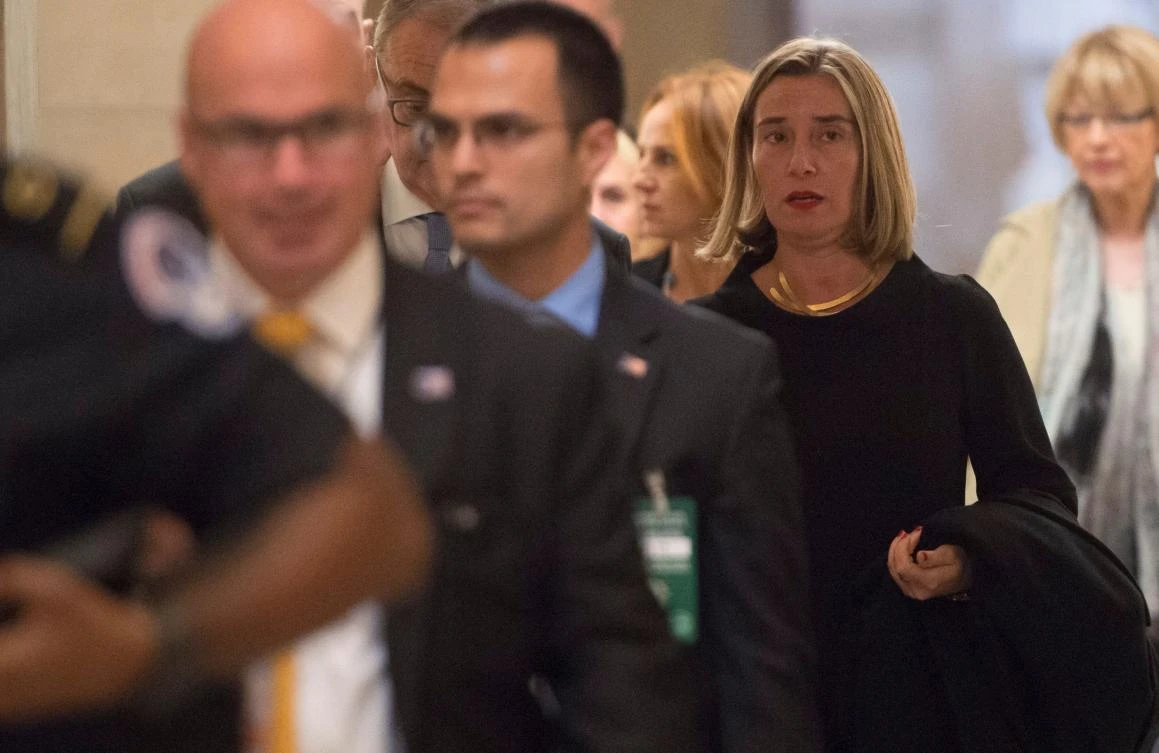 Federica Mogherini (R), High Representative of the European Union for Foreign Affairs and Security Policy and Vice President of the European Commission, walks through the US Capitol between meetings in Washington, DC, Nov. 7, 2017. EU foreign policy chief Mogherini brings her campaign to save the Iran nuclear deal from US President Donald Trump’s scorn to Capitol Hill, where senators are working on a bill that could kill it. (AFP/Saul Loeb)