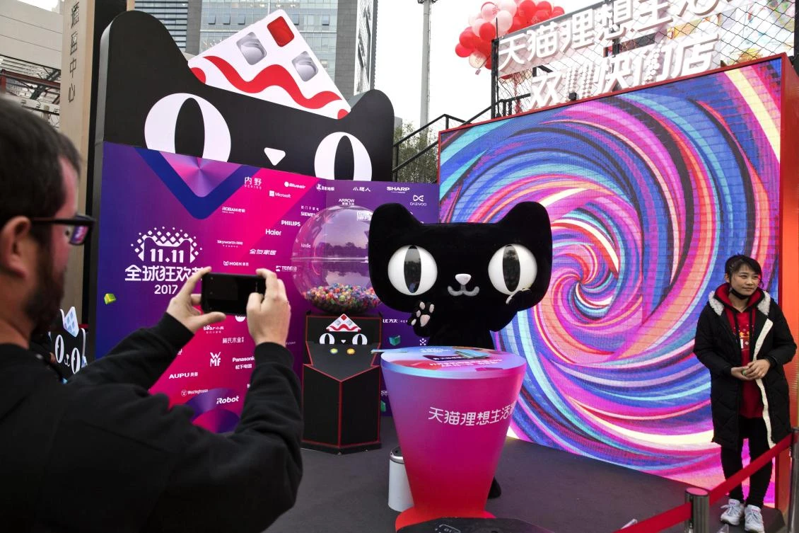 A mascot for Tmall, an online shopping website owned by Alibaba, promotes Singles Day in Beijing, China, Monday, Nov. 6, 2017.