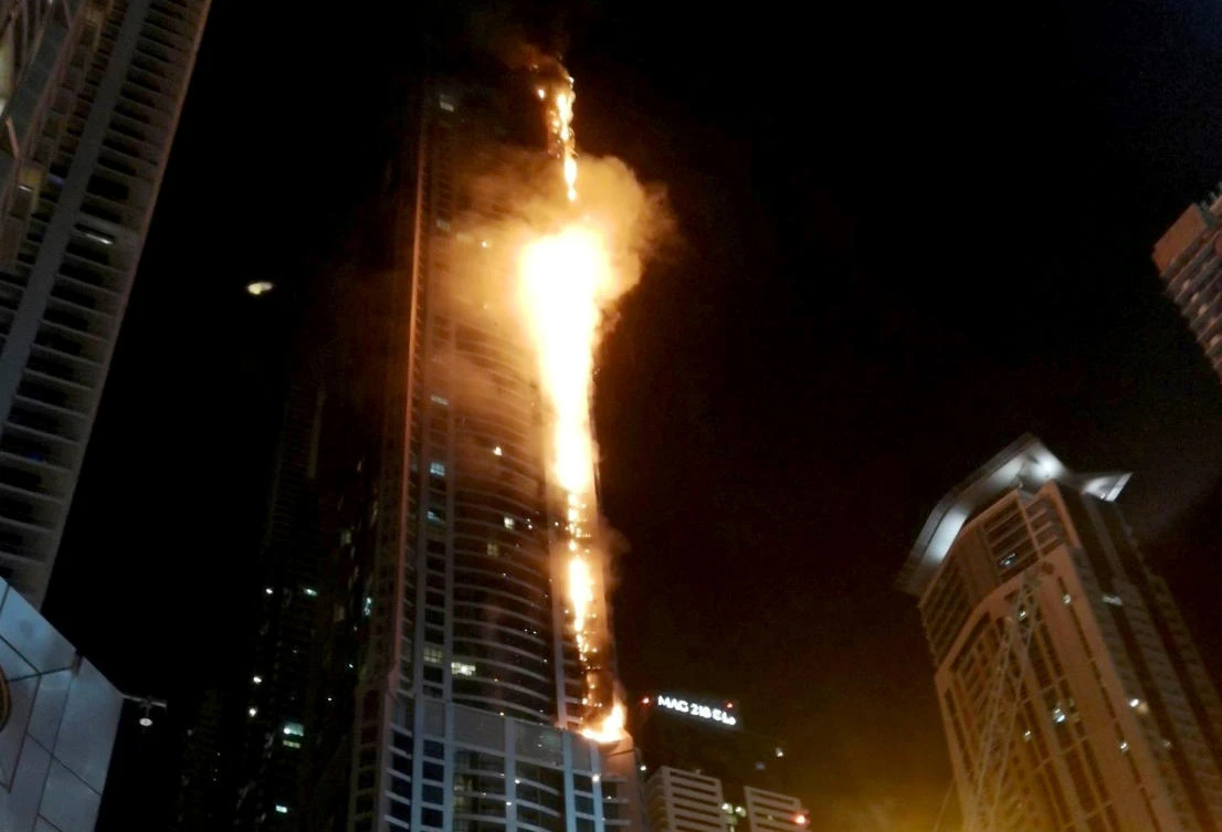 Flames shoot up the sides of The Torch residential building in Dubai in this Aug. 4, 2017 picture. (Mitch Williams via Reuters)