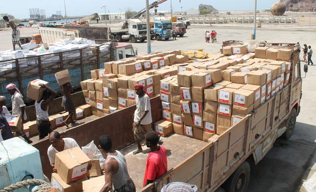 Yemeni workers unload medical aid boxes from a boat carrying 460 tonnes of Emirati relief aid that docked in the port of the city of Aden into a truck, in this May 24, 2015 file photo. (AFP)