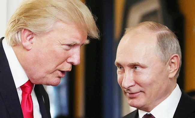 US President Donald Trump (L) chats with Russia's President Vladimir Putin as they attend the APEC Economic Leaders' Meeting, part of the Asia-Pacific Economic Cooperation (APEC) leaders' summit in the central Vietnamese city of Danang on Saturday. (AFP)