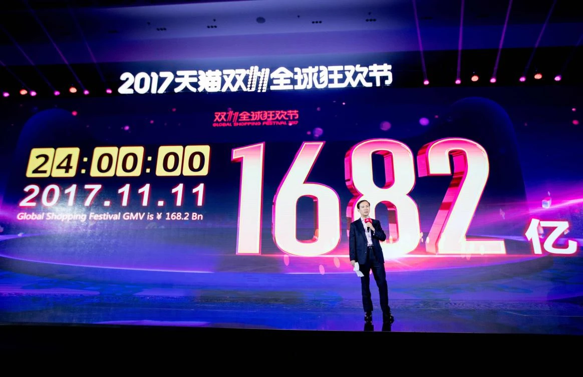 Alibaba CEO Daniel Zhang speaks in front of a screen showing total sales at over 168 billion yuan shortly after the end of the 11.11, or Singles Day shopping festival on November 12. (AFP)