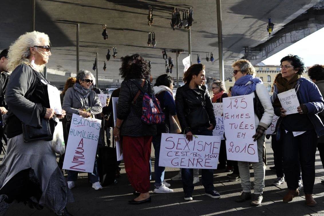 Women hold placards as they gather for a rally at the Old Port of Marseille, southern France, on October 29, 2017. (File photo by AFP)