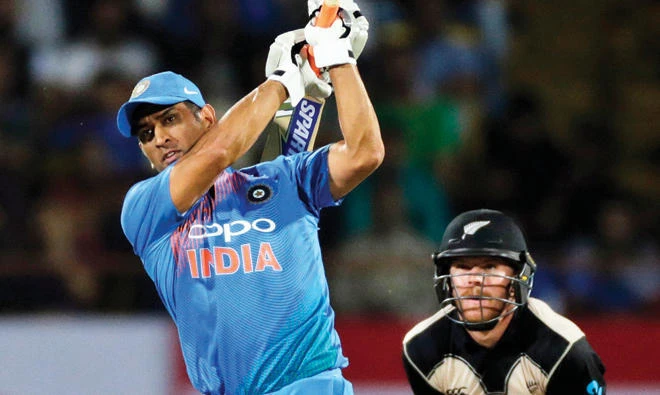 MS Dhoni cuts loose during a Twenty20 match against New Zealand in Rajkot. (AP)