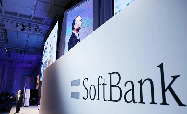 In this July 20, 2017, photo, SoftBank Group Corp. Chief Executive Officer Masayoshi Son, left, speaks during a SoftBank World presentation at a hotel in Tokyo. (AP)