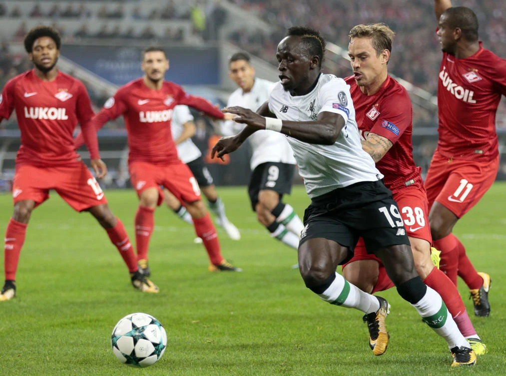 In this file photo, Liverpool’s Sadio Mane, front, duels for the ball with Spartak’s Andrei Eschenko during the Champions League soccer match between Spartak Moscow and Liverpool in Moscow, Russia on Tuesday, September 26, 2017. (File photo by AP)