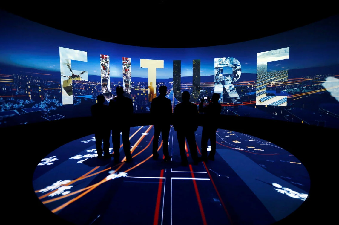 Visitors watch a 3-D presentation during an exhibition on ‘Neom,’ a new business and industrial city set to be built in Saudi Arabia. (Reuters)