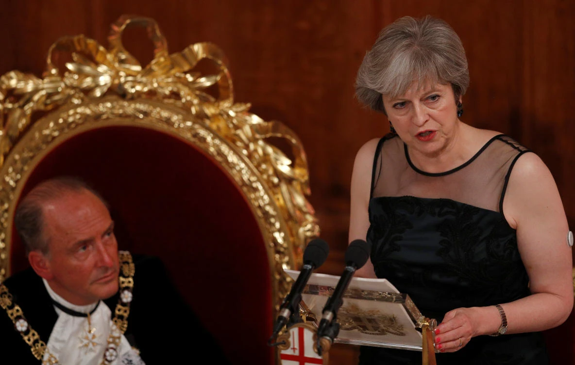 Britain's Prime Minister Theresa May makes a speech at the Lord Mayor's Banquet at the Guildhall, as Lord Mayor of the City of London Charles Bowman listens, in London, Britain November 13, 2017. (Reuters)