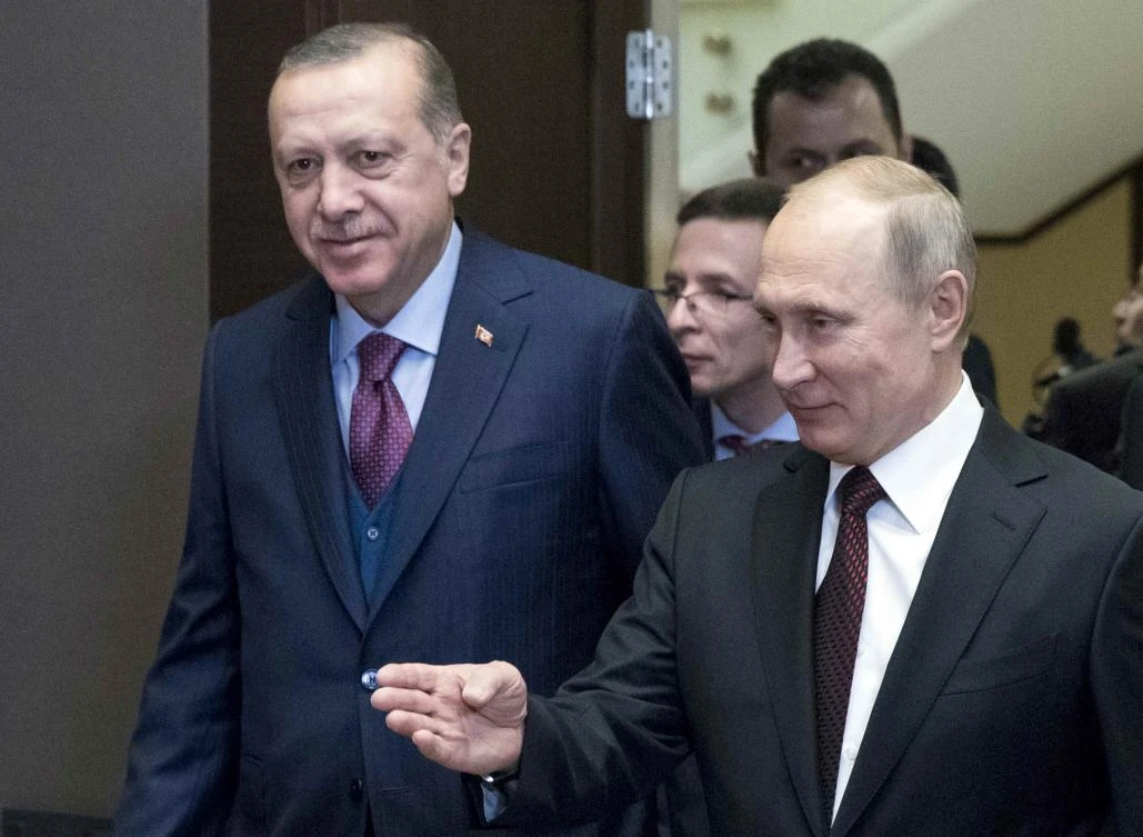 Russia’s President Vladimir Putin shows the way to Turkey’s President Tayyip Erdogan during a meeting on Monday in Sochi, Russia. (Reuters)