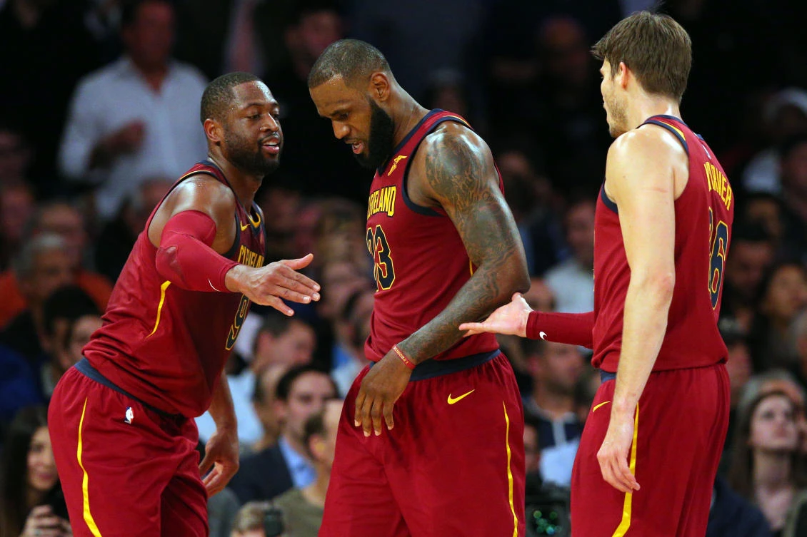 Cleveland Cavaliers shooting guard Dwyane Wade (9) and Cleveland Cavaliers small forward LeBron James (23) and Cleveland Cavaliers shooting guard Kyle Korver (26) react during the fourth quarter against the New York Knicks at Madison Square Garden. (Brad Penner-USA Today Sports)