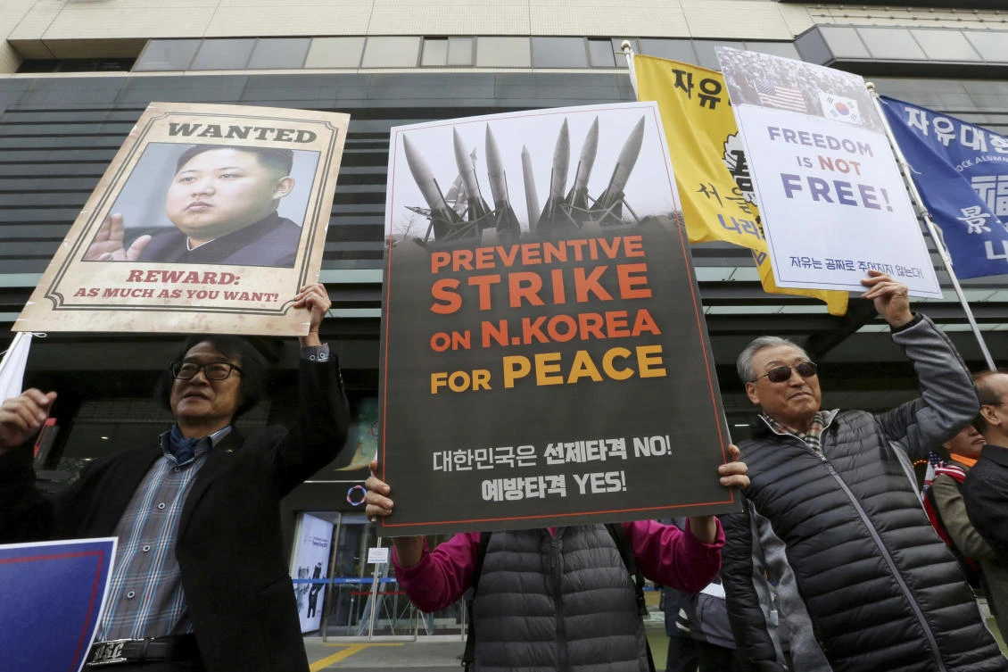 South Koreans protest against North Korea and Kim Jong Un during a rally near the US Embassy in Seoul, South Korea, Monday, Nov. 6, 2017. President Donald Trump is scheduled to arrive in South Korea on Nov. 7 for a two-day visit and will meet with South Korean President Moon Jae-in. (AP/Ahn Young-joon)