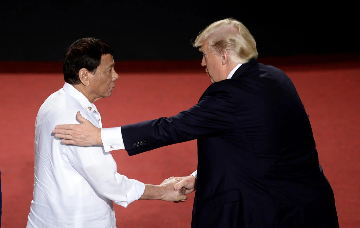 Philippine President Rodrigo Duterte, left, shakes hands with US President Donald Trump during the 31st Association of Southeast Asian Nations (ASEAN) Summit in Cultural Center of the Philippines (CCP) in Manila on Monday Nov. 13, 2017.(Noel Celis/Pool Photo via AP)