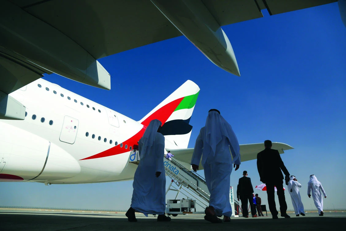 Visitors walk past an Airbus A380 during this week’s Dubai Airshow. (Reuters)
