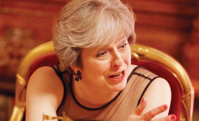 Britain’s Prime Minister Theresa May talks with guests after making a speech on Monday at the Lord Mayor’s Banquet in London. (Reuters)