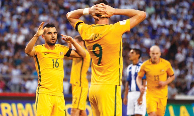 The sight of Australians with their hands on their heads is not one West Asian fans should wish to see if they want more Asian World Cup spots. (Reuters)