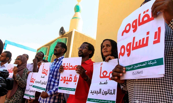 Sudanese journalists protest against a proposed new press law that aims to tighten restrictions on media freedom, at the headquarters of the National Council for Press and Publications in the capital Khartoum on Wednesday, November 15, 2017. (AFP)