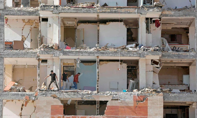 A view of the buildings left damaged by a massive earthquake in Sarpol-e Zahab, Iran. (AFP)