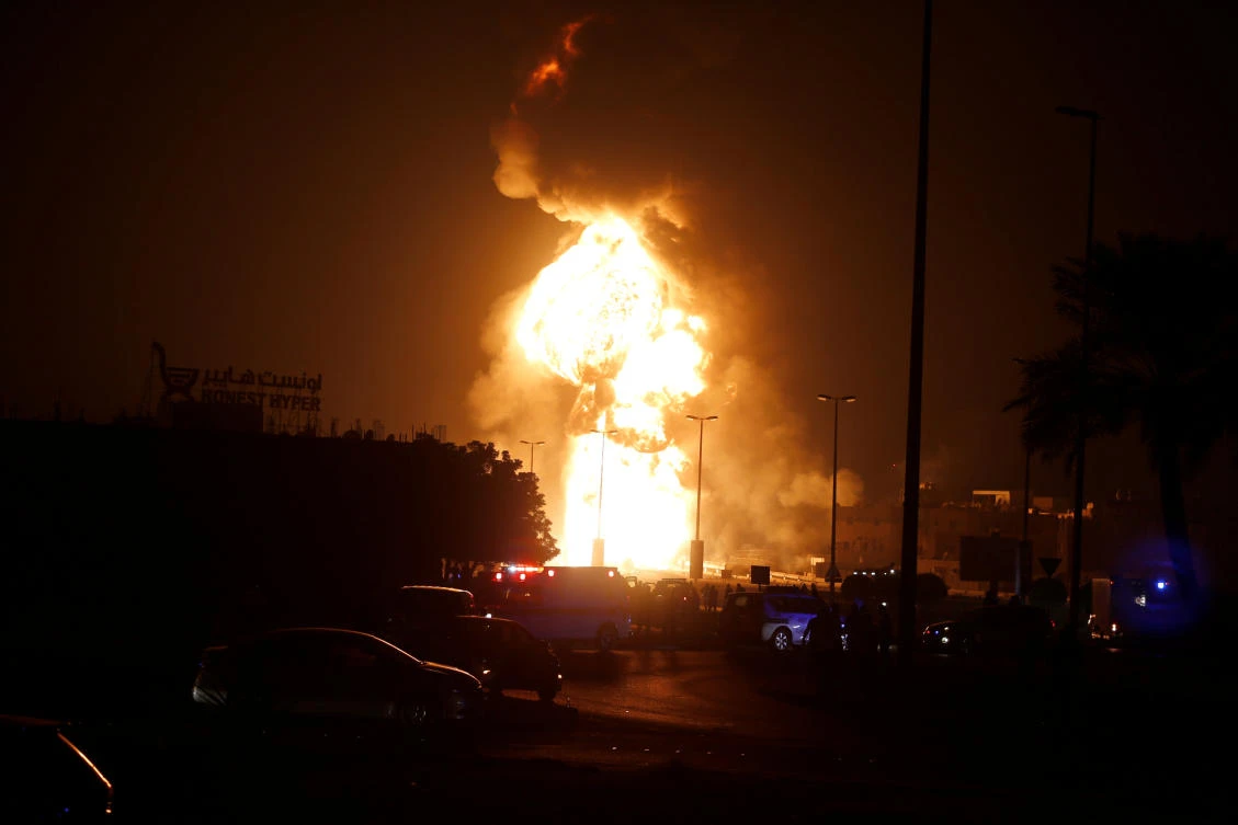 Emergency and rescue workers are seen blocking the road leading to a fire in at oil pipeline in Buri village south of Manama, Bahrain, November 10, 2017. (Reuters)