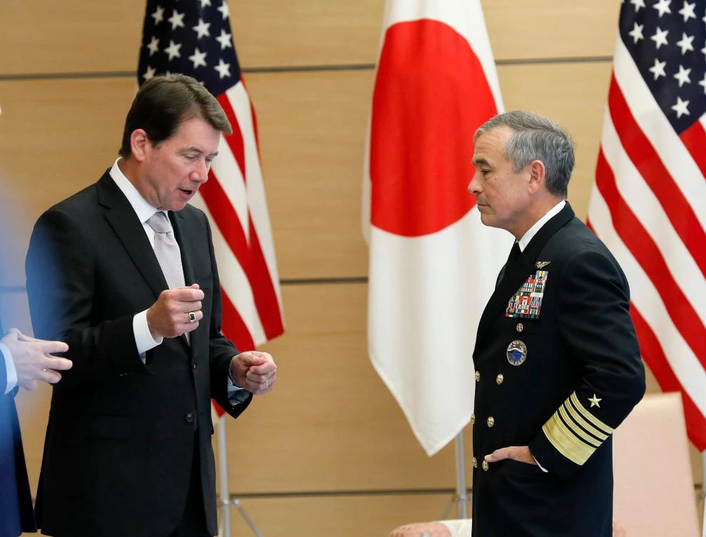 Admiral Harry Harris, the head of the US military’s Pacific Command, right, listens to William F. Hagerty, the US Ambassador to Japan, as Harris makes a courtesy visit at the prime minister’s official residence in Tokyo on November 16. (AFP)