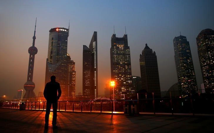 Above, the Pudong financial district of Shanghai. The ratio of China’s financial sector to the overall economy “is the highest ratio in the world,” said Huang Qifan, deputy chairman of the economic and finance committee under the National People’s Congress, and is “not a good thing.” (Reuters)