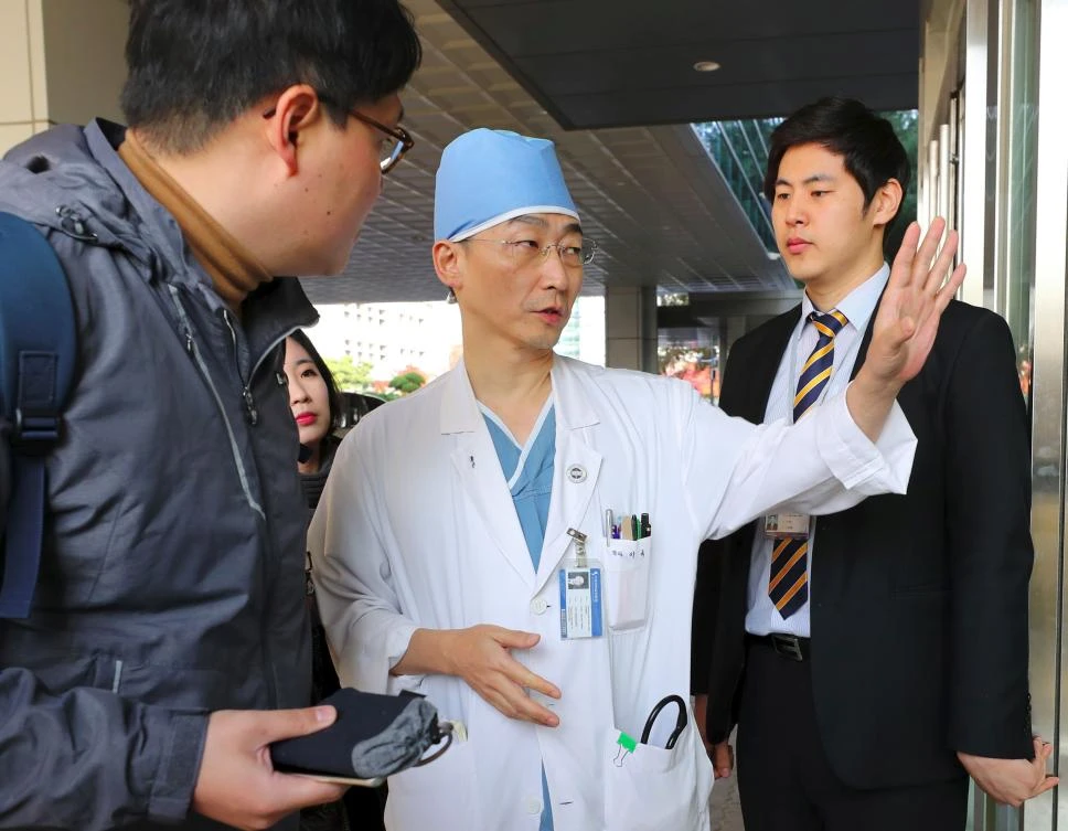 South Korean medical doctor Lee Cook-Jong, who carried out surgery on gunshot wounds sustained by a North Korean soldier, speaks to journalists at Ajou University Hospital in Suwon, south of Seoul. (AFP)