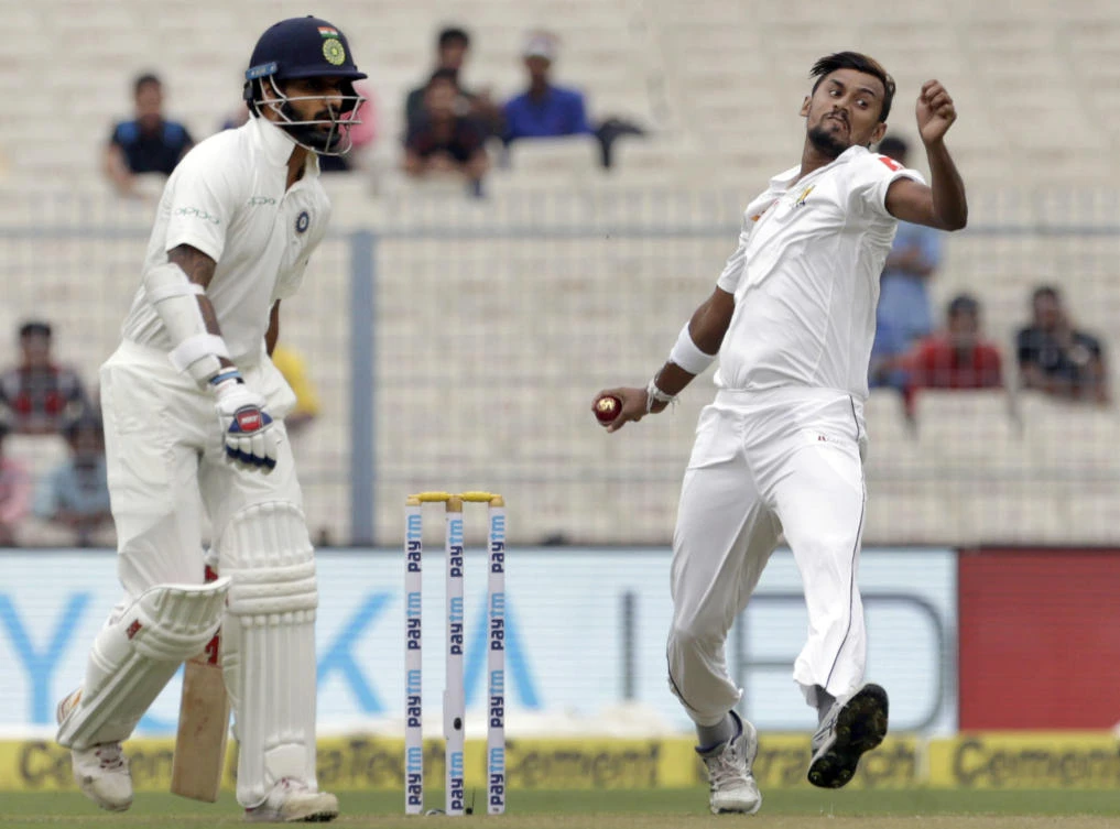 Sri Lanka’s Suranga Lakmal, right, bowls a delivery during the first day of their first test cricket match against India in Kolkata, India, Thursday, Nov. 16, 2017. (AP Photo/Bikas Das)
