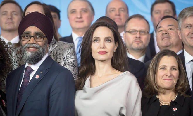 Angelina Jolie, center, stands between Canadian Defense Minister Harjit Sajjan, left, and Minister of Foreign Affairs Chrystia Freeland at the 2017 United Nations Peacekeeping Defense Ministerial conference in Vancouver, on Wednesday. (AP)