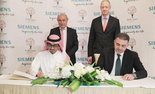 Misk and Siemens officials sign a memorandum of understanding at Misk Global Forum.