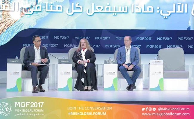Esther Baldwin, artificial intelligence strategist for Intel, center, William Tunstall-Pedoe, artificial intelligence entrepreneur formerly with Amazon Alexa, right, and moderator Riad Hamade, executive editor for the Middle East and Africa, Bloomberg News, at a panel discussion on ‘Robots and Us: Who Will be Doing What Tomorrow?’ at the Misk Global Forum in Riyadh on Thursday. (Photo courtesy: MGF)