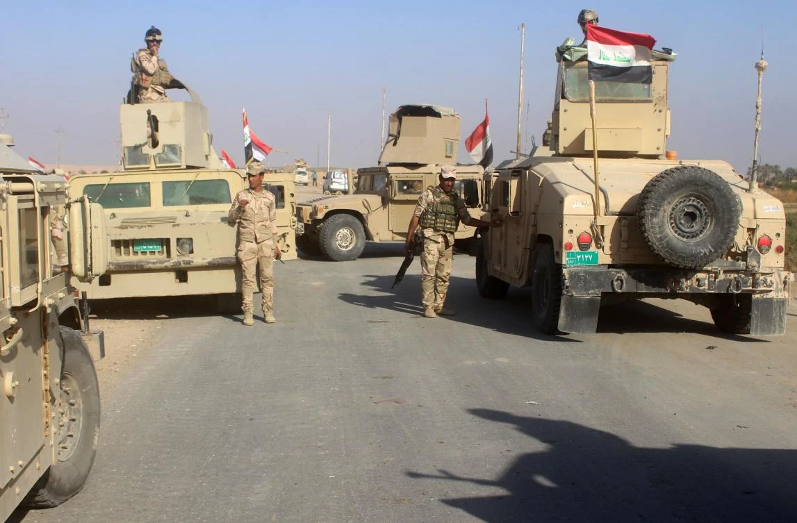 Iraqi security forces gather in the Rawa area during an operation to retake the Euphrates Valley town from the Daesh group on November 11, 2017. (AFP)