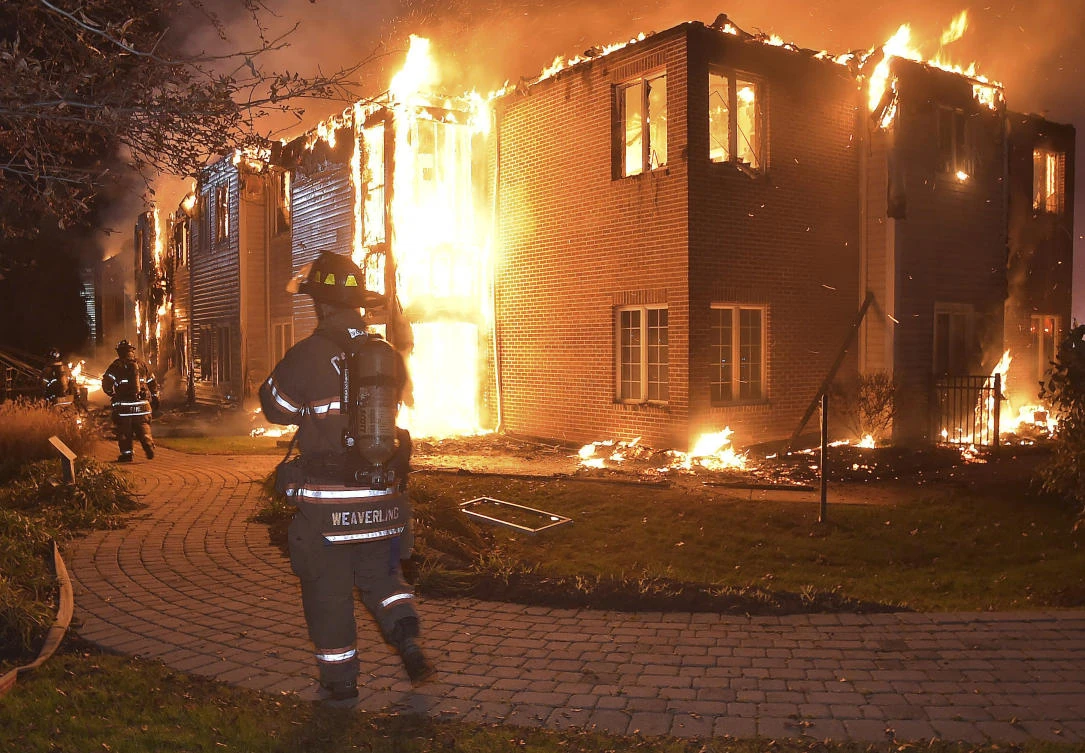 Firefighters battle a blaze at the Barclay Friends Senior Living Community in West Chester, Pennsylvania, on Thursday, Nov. 16, 2017. (Pete Bannan/Daily Local News via AP)