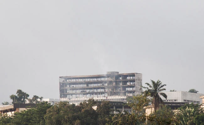 This photo taken on November 17, 2017 in Yaounde, Cameroon, shows the damaged building of Cameroon's parliament after a fire swept through the main building overnight, causing substantial damage. (AFP)
