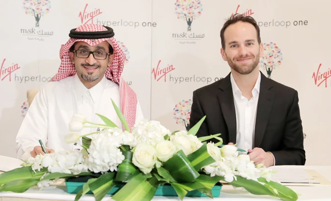 Bader Al-Asaker, secretary-general of the Misk Foundation, and Virgin Hyperloop One founder Josh Giegel at the signing ceremony in Riyadh on Thursday.