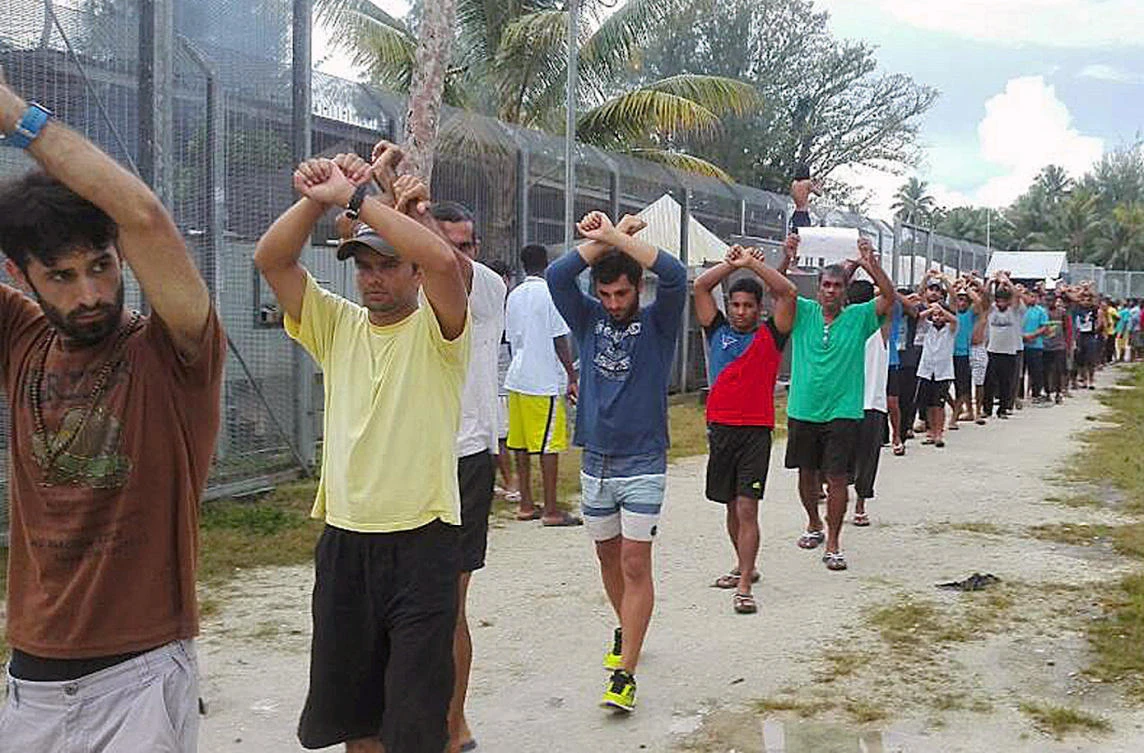 Detainees stage a protest inside the compound at the Manus Island detention center in Papua New Guinea. There are more than 400 asylum seekers languishing inside the recently closed detention center. (Refugee Action via Reuters)