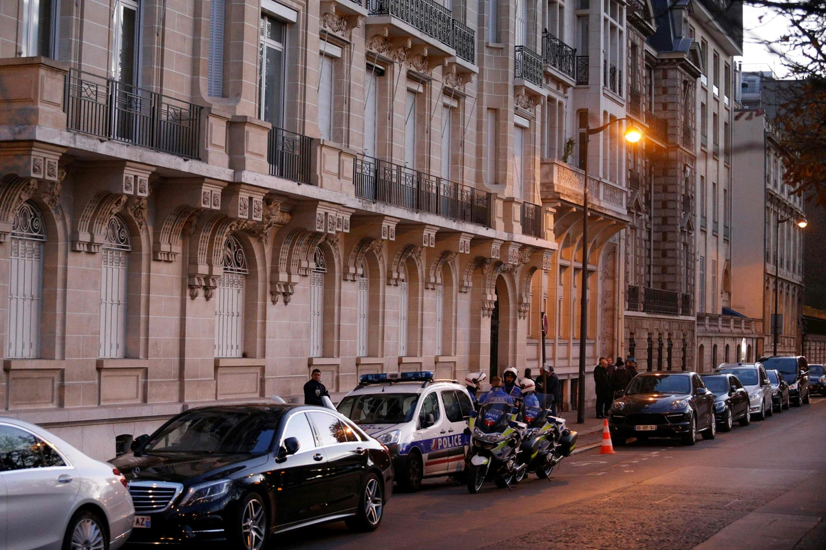 Above, police stand guard in front of a building in Paris where Lebanese Prime Minister Saad Hariri is set to meet French President Emmanuel Macron. (AFP)