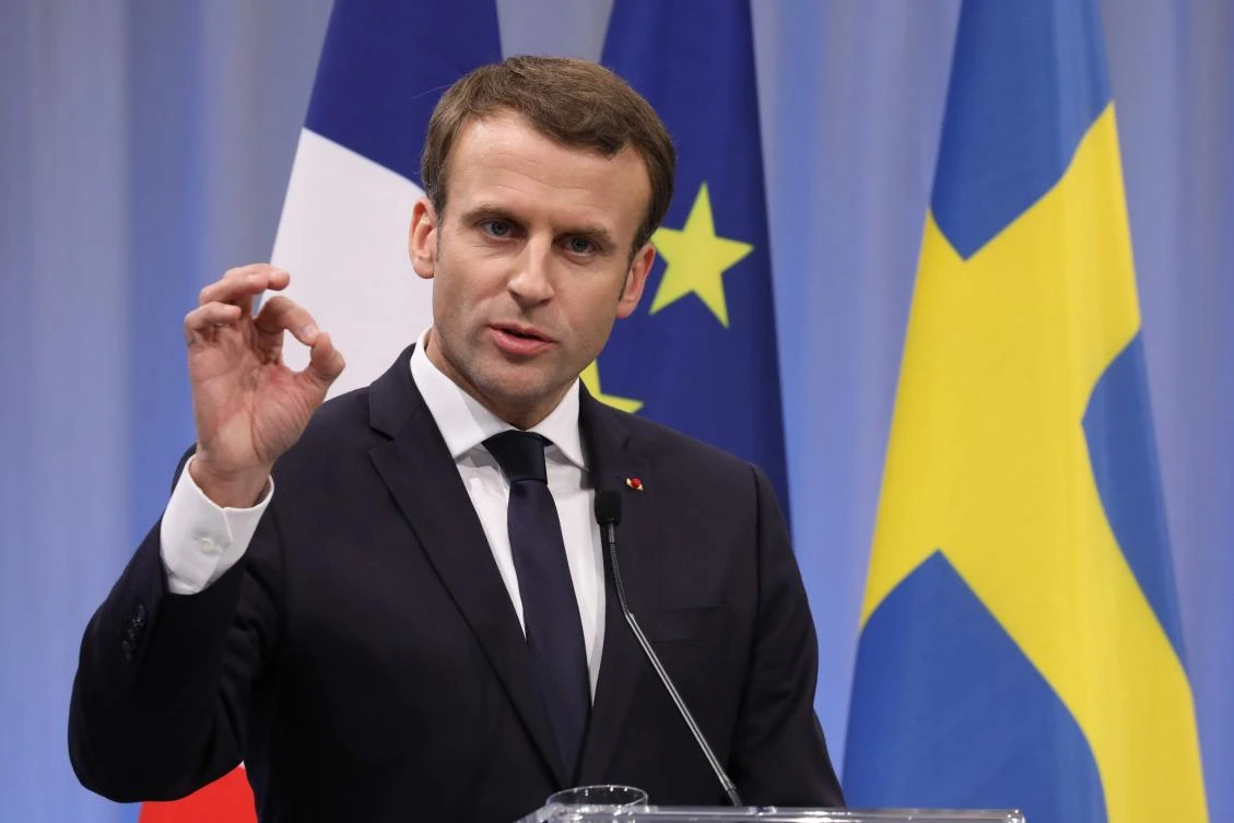 French President Emmanuel Macron said on Friday that Tehran should be less aggressive in the region and should clarify the strategy around its ballistic missile program. (AFP)