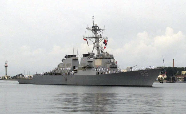 In this Aug. 8, 2016, file photo, the guided missile destroyer USS Benfold arrives at port in Qingdao, China. According to the US Navy 7th Fleet, a Japanese tug boat lost propulsion and drifted into the USS Benfold during a towing exercise in Sagami Bay on Saturday, Nov. 18, 2017. (AP Photo/Borg Wong, File)
