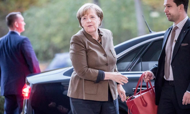 German Chancellor and chair of the German Christian Democratic Union (CDU) Angela Merkel arrives for coalition talks in Berlin, on Sunday. (AP)