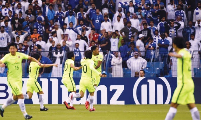 Urawa players celebrate with Rafael Silva after he opened the scoring against Al-Hilal in the first leg of the Champions League final. (AFP)