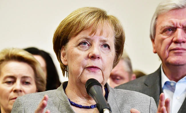 German Chancellor and leader of the Christian Democratic Union (CDU) party, Angela Merkel, speaks after exploratory talks on forming a new government broke down on Sunday in Berlin. (AFP)
