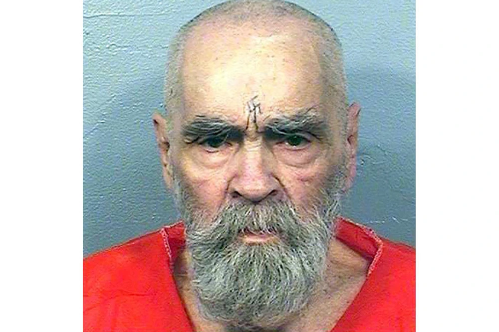 This handout photo received Aug. 21, 2017, courtesy of California Department of Corrections and Rehabilitation shows inmate Charles Manson. Notorious US killer Charles Manson, who led a California cult that killed pregnant Hollywood star Sharon Tate, has been hospitalized in deteriorating health, entertainment news site TMZ said Wednesday, Nov. 15, 2017. Citing an anonymous source, the site said the 83-year-old with a swastika tattoo on his forehead was rushed to Bakersfield hospital in central California three days ago and underwent a series of treatments, escorted by five policeman. (AFP/California Department of Corrections and Rehabilitation)