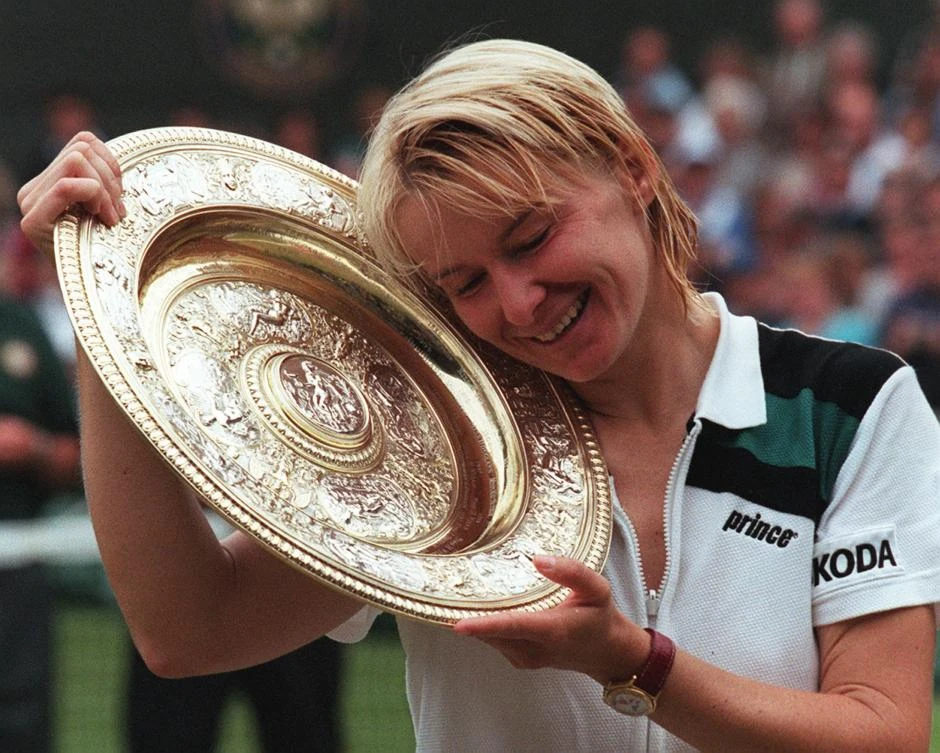 Above, Czech Republic’s Jana Novotna enjoying her championship trophy after winning the final of the women’s singles at the Wimbledon Tennis Championships in this July 4, 1998 photo. Novotna won a total of 24 singles tournaments and 76 doubles tournaments in her career that spanned from 1987 to 1999. (AFP)