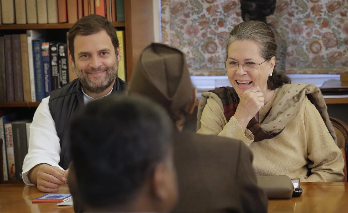 Congress Party President Sonia Gandhi, right, with party Vice President and her son Rahul Gandhi, left, during the Congress Working Committee (CWC) meeting in New Delhi, on Monday. (AP)