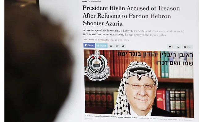 Photo of Israel president in Palestinian scarf sparks probe